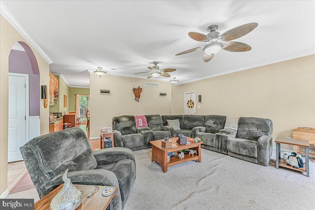 117 Woodrow Ln, Port Deposit, MD 21904 - living room featuring ornamental molding, a ceiling fan, arched walkways, and light colored carpet