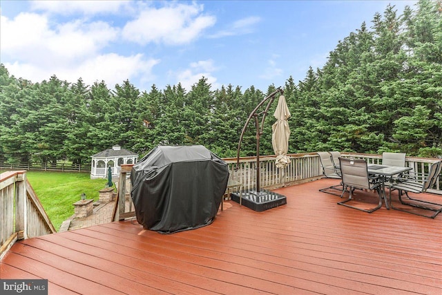 117 Woodrow Ln, Port Deposit, MD 21904 - wooden terrace with outdoor dining area, a grill, and a forest view