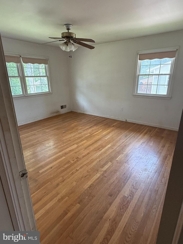 7400 Roxbury Ave, Manassas, VA 20109 - empty room featuring light wood-style floors and a ceiling fan