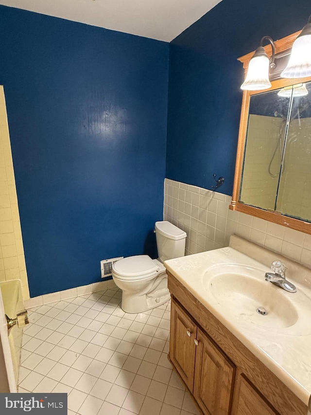 7400 Roxbury Ave, Manassas, VA 20109 - bathroom featuring tile patterned floors, vanity, and a shower