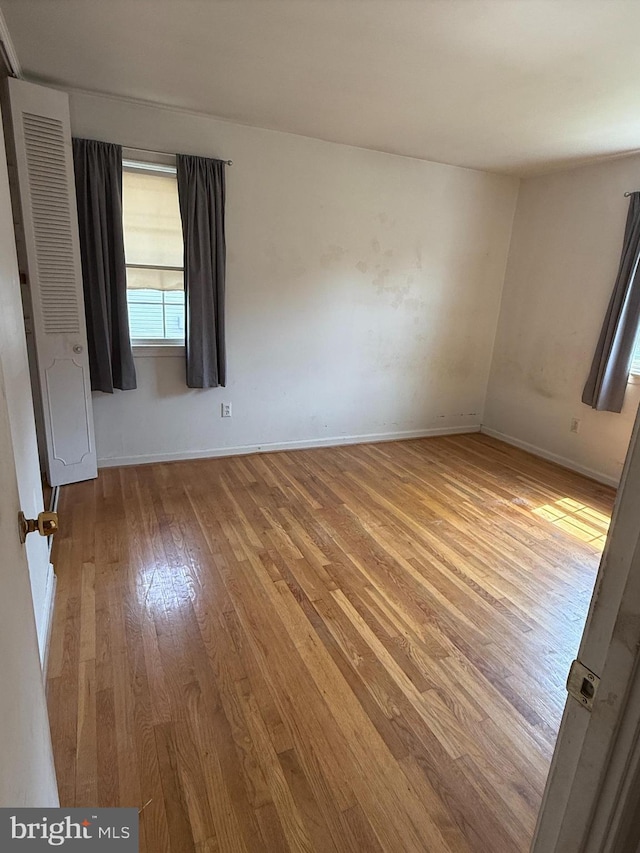 7400 Roxbury Ave, Manassas, VA 20109 - unfurnished room featuring hardwood / wood-style floors and a heating unit