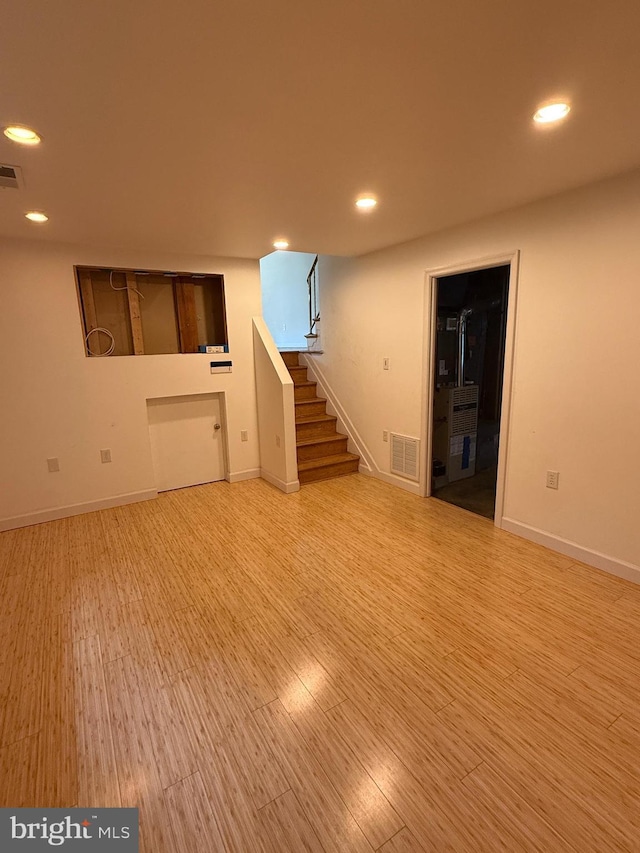 7400 Roxbury Ave, Manassas, VA 20109 - finished below grade area with stairs, wood finished floors, and recessed lighting