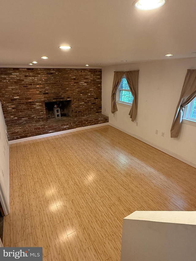 7400 Roxbury Ave, Manassas, VA 20109 - unfurnished living room featuring a fireplace, recessed lighting, and wood finished floors