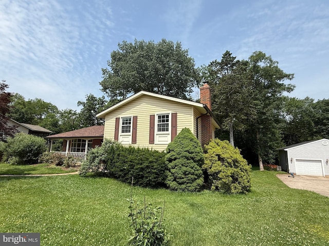 7400 Roxbury Ave, Manassas, VA 20109 - view of front of house featuring a chimney, a front lawn, a garage, and concrete driveway