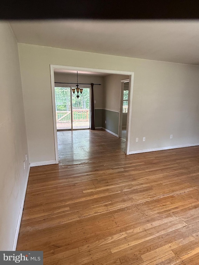 7400 Roxbury Ave, Manassas, VA 20109 - empty room with a chandelier and wood finished floors