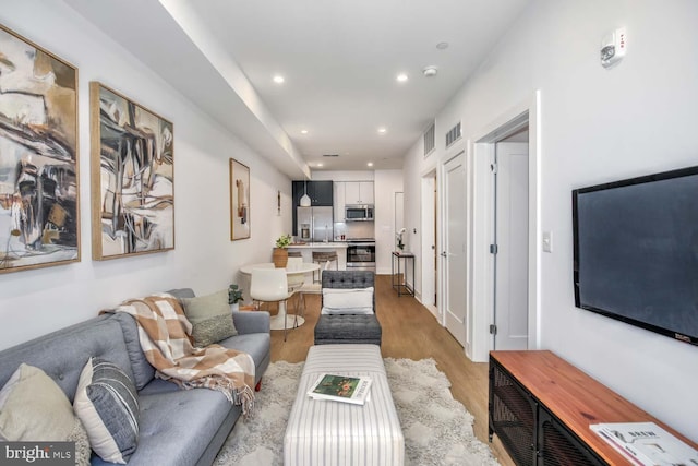 2310 4th St NE Unit B5, Washington, DC 20002 - living room featuring light wood-type flooring and recessed lighting