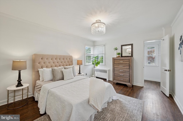 12 Rodney Rd, Bryn Mawr, PA 19010 - bedroom with radiator, a chandelier, dark wood finished floors, and crown molding