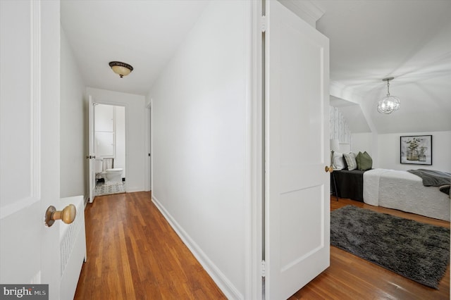 12 Rodney Rd, Bryn Mawr, PA 19010 - corridor with wood finished floors and a chandelier