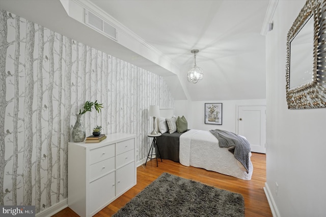 12 Rodney Rd, Bryn Mawr, PA 19010 - bedroom with wood finished floors, a chandelier, and vaulted ceiling