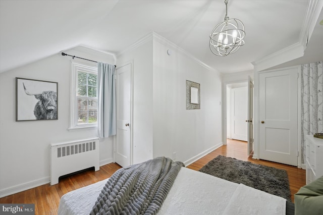 12 Rodney Rd, Bryn Mawr, PA 19010 - bedroom with radiator, a chandelier, wood finished floors, crown molding, and lofted ceiling