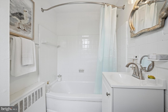 12 Rodney Rd, Bryn Mawr, PA 19010 - bathroom with radiator heating unit, shower / bath combo, vanity, and tile walls