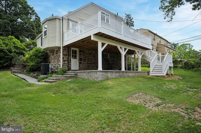 12 Rodney Rd, Bryn Mawr, PA 19010 - rear view of property featuring stairway, a yard, and a wooden deck