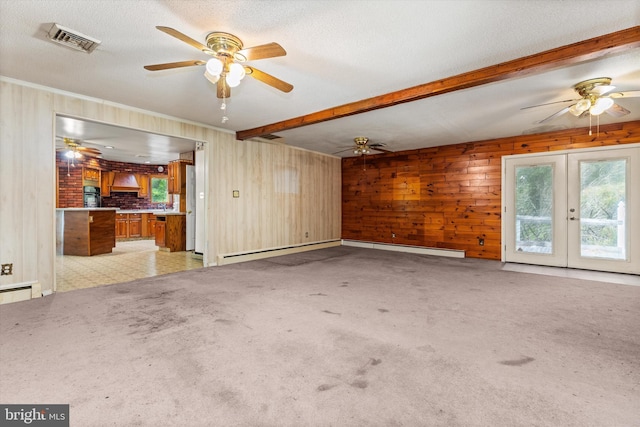 26140 High Banks Dr, Salisbury, MD 21801 - unfurnished living room featuring french doors, a ceiling fan, beam ceiling, light colored carpet, and wooden walls