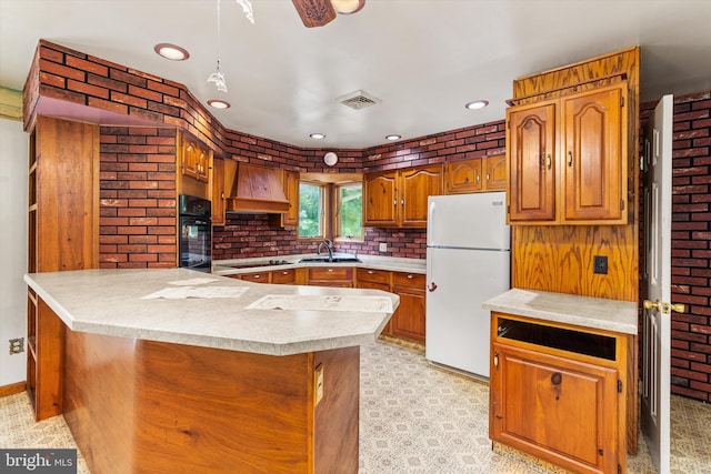 26140 High Banks Dr, Salisbury, MD 21801 - kitchen with black appliances, custom range hood, a peninsula, light countertops, and brown cabinetry