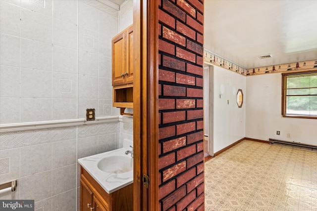 26140 High Banks Dr, Salisbury, MD 21801 - bathroom featuring vanity and tile walls