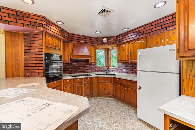 26140 High Banks Dr, Salisbury, MD 21801 - kitchen featuring black appliances, premium range hood, light countertops, brown cabinets, and recessed lighting