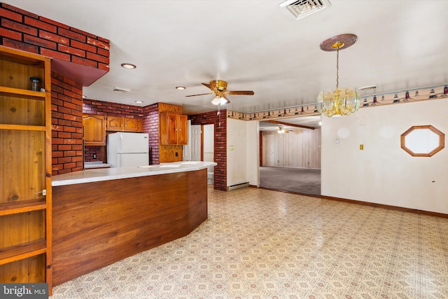 26140 High Banks Dr, Salisbury, MD 21801 - kitchen with freestanding refrigerator, a ceiling fan, light countertops, a chandelier, and light floors