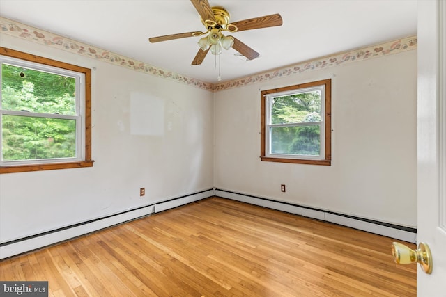 26140 High Banks Dr, Salisbury, MD 21801 - unfurnished room with a baseboard heating unit, light wood-style flooring, and a ceiling fan