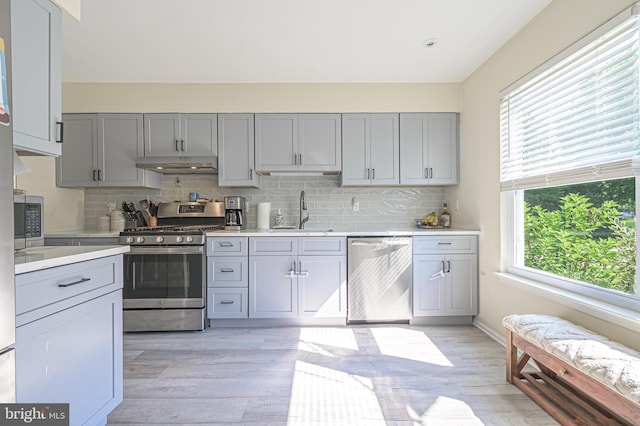 39 Allison Pl, Egg Harbor Township, NJ 08234 - kitchen featuring stainless steel appliances, gray cabinets, under cabinet range hood, and light countertops