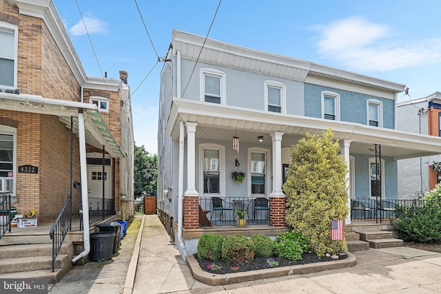 4334 Mitchell St, Philadelphia, PA 19128 - multi unit property featuring a porch, stucco siding, and brick siding