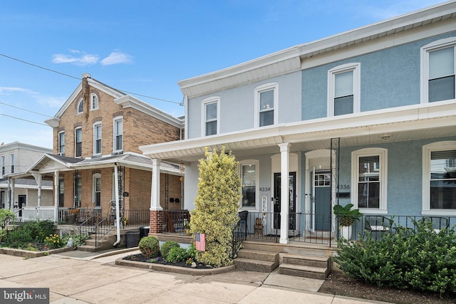 4334 Mitchell St, Philadelphia, PA 19128 - view of property with covered porch and stucco siding