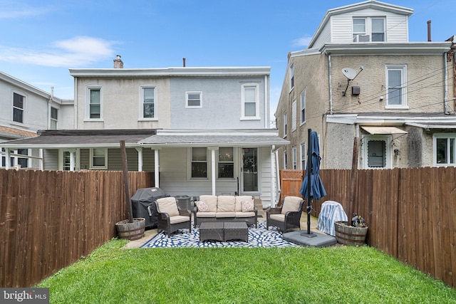 4334 Mitchell St, Philadelphia, PA 19128 - rear view of property featuring an outdoor hangout area, a fenced backyard, a chimney, stucco siding, and a patio area