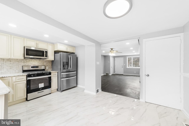 1171 E Sharpnack St, Philadelphia, PA 19150 - kitchen with appliances with stainless steel finishes, cream cabinets, light marble finish floors, and recessed lighting