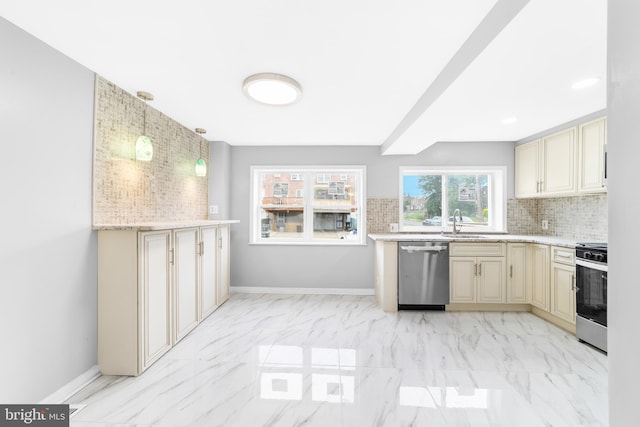 1171 E Sharpnack St, Philadelphia, PA 19150 - kitchen with stainless steel appliances, cream cabinets, decorative backsplash, and light marble finish floors