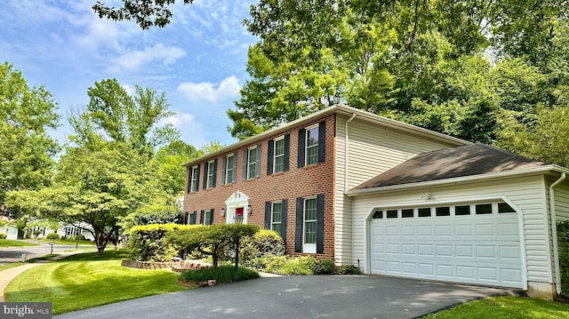 11531 Paramus Dr, North Potomac, MD 20878 - view of front of house with an attached garage, driveway, and a front lawn