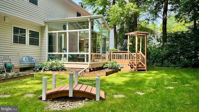 11531 Paramus Dr, North Potomac, MD 20878 - view of green lawn featuring a sunroom and a wooden deck