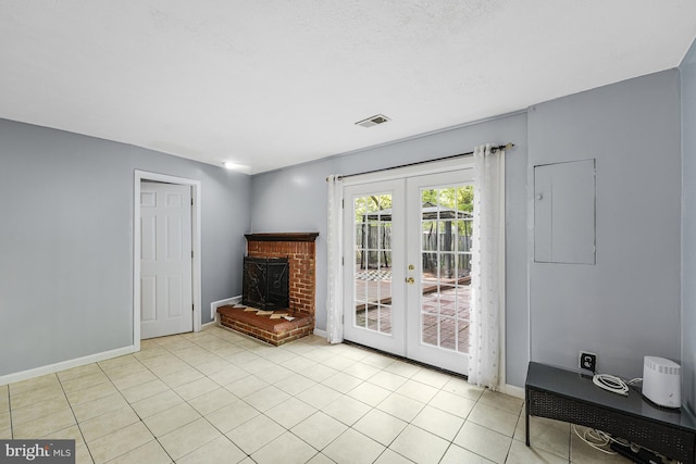 9126 Fisteris Ct, Springfield, VA 22152 - unfurnished living room featuring french doors, light tile patterned floors, and a brick fireplace