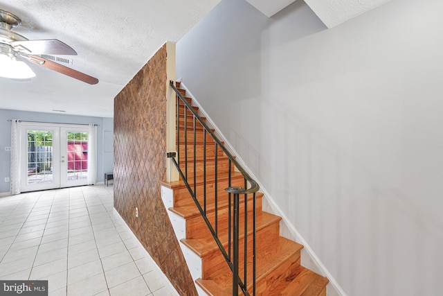 9126 Fisteris Ct, Springfield, VA 22152 - stairs featuring ceiling fan, tile patterned flooring, french doors, and a textured ceiling