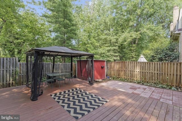 9126 Fisteris Ct, Springfield, VA 22152 - wooden terrace featuring a gazebo, a fenced backyard, and outdoor dining area