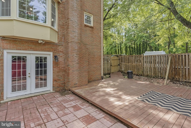 9126 Fisteris Ct, Springfield, VA 22152 - wooden deck with french doors, a gate, and a fenced backyard