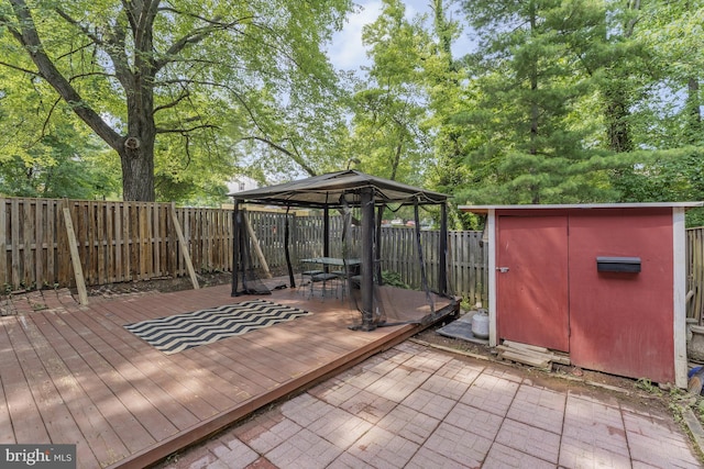 9126 Fisteris Ct, Springfield, VA 22152 - wooden deck with a gazebo, a shed, and a fenced backyard
