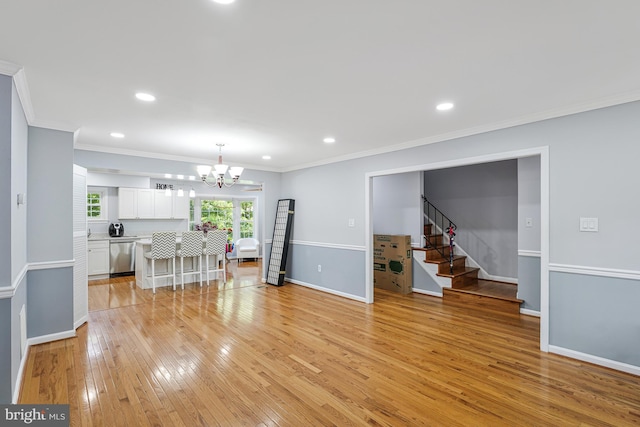 9126 Fisteris Ct, Springfield, VA 22152 - living area with a chandelier, light wood-style floors, stairway, ornamental molding, and recessed lighting