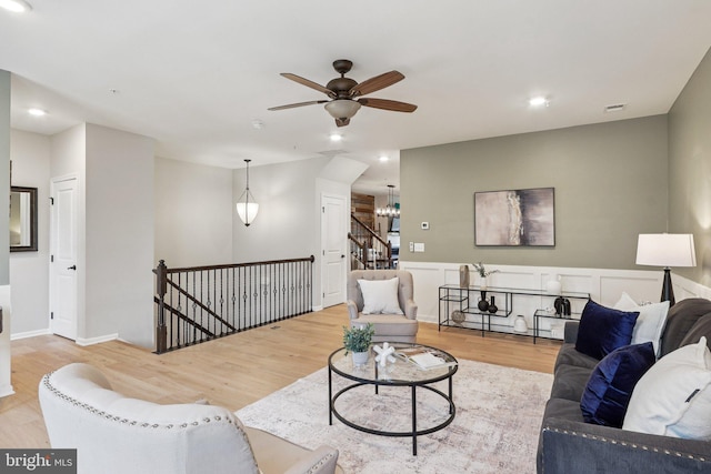 269 High Rail Ter SE, Leesburg, VA 20175 - living room featuring a ceiling fan, wood finished floors, a chandelier, and recessed lighting