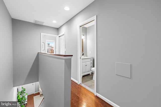 503 E Fort Ave, Baltimore, MD 21230 - hallway with wood finished floors, an upstairs landing, and recessed lighting