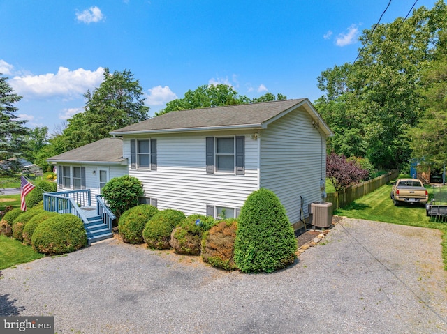 3341 Howellsville Rd, Front Royal, VA 22630 - split level home with a front yard, a deck, and a shingled roof