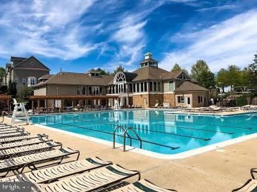 6541 Grange Ln Unit 401, Alexandria, VA 22315 - community pool featuring a patio area