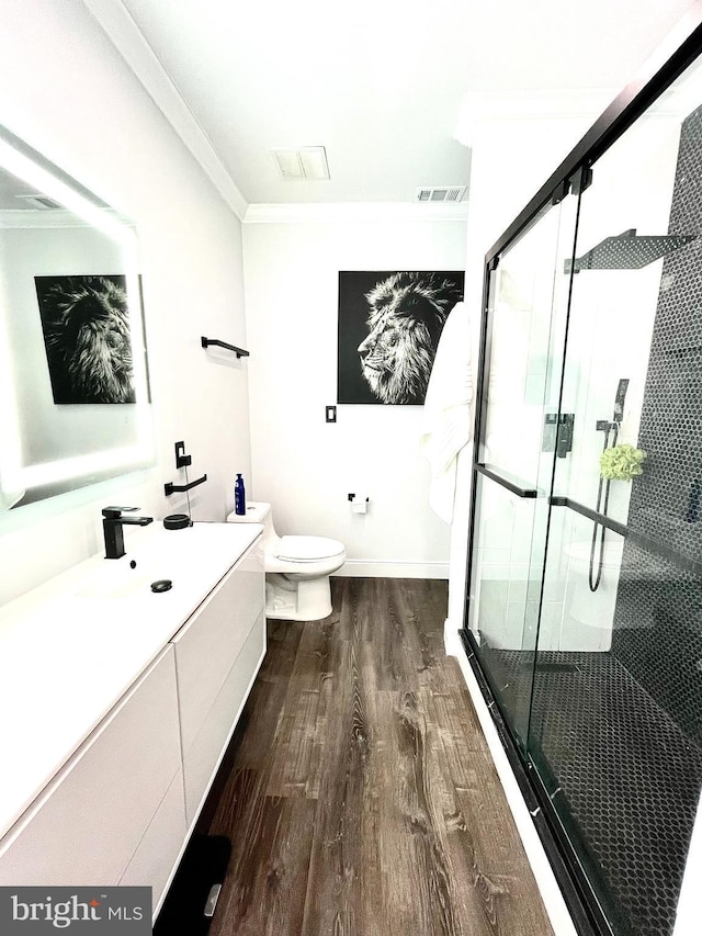 6541 Grange Ln Unit 401, Alexandria, VA 22315 - full bathroom with wood finished floors, crown molding, vanity, and a shower stall