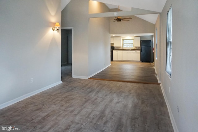 83 Walnut Ln, Pine Hill, NJ 08021 - unfurnished living room featuring ceiling fan, high vaulted ceiling, and dark wood-style floors