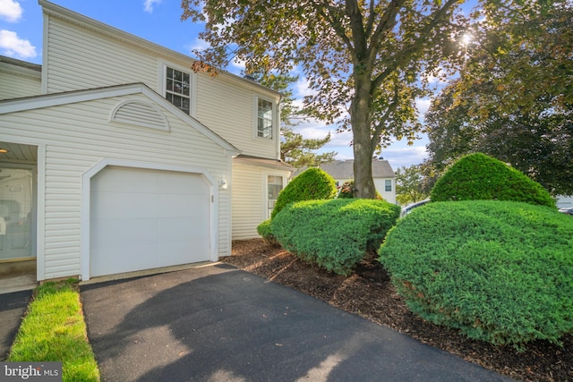 26 Portsmouth Ct, Holland, PA 18966 - view of home's exterior featuring asphalt driveway and an attached garage