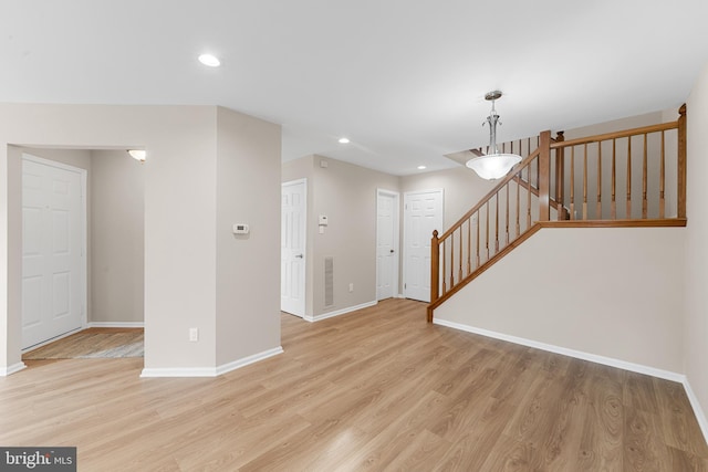 26 Portsmouth Ct, Holland, PA 18966 - unfurnished living room with light wood finished floors, stairway, and recessed lighting