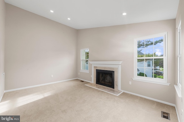 26 Portsmouth Ct, Holland, PA 18966 - unfurnished living room featuring light colored carpet, a tiled fireplace, and recessed lighting
