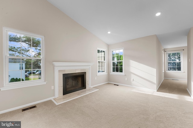 26 Portsmouth Ct, Holland, PA 18966 - unfurnished living room featuring vaulted ceiling, carpet flooring, plenty of natural light, a tiled fireplace, and recessed lighting