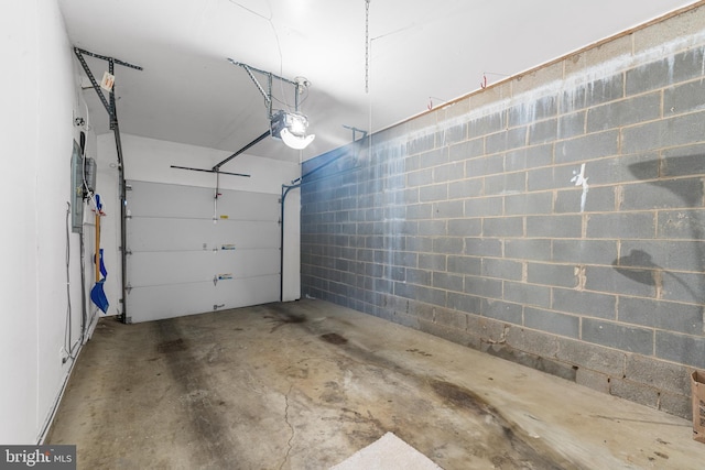 26 Portsmouth Ct, Holland, PA 18966 - garage featuring concrete block wall and a garage door opener
