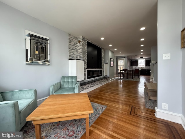 643 Jamestown Ave, Philadelphia, PA 19128 - living room with wood finished floors, a stone fireplace, and recessed lighting