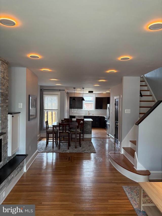 643 Jamestown Ave, Philadelphia, PA 19128 - dining space with plenty of natural light, stairway, dark wood-style flooring, and a fireplace