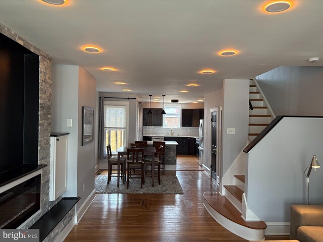 643 Jamestown Ave, Philadelphia, PA 19128 - dining room featuring stairway, dark wood-style floors, and a fireplace